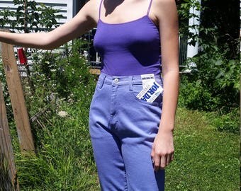 Dead stock 80's Jordache jeans. High waisted purple. Vintage size 10 stretch. Tapered leg.