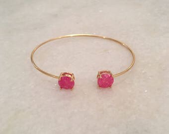 thin gold bracelet with pink stones