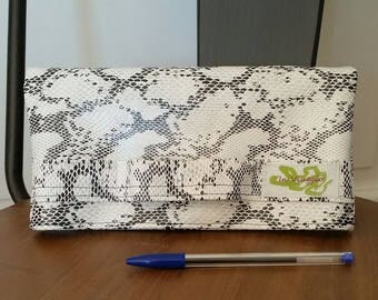 A faux leather snakeskin clutch
