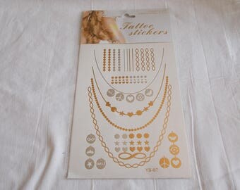 1 Board with tattoo in gold and silver tones