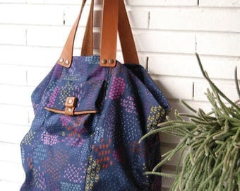 Large colorful graphics and blue fabric tote bag