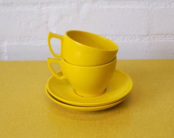 Vintage Melaware cups and saucers in yellow