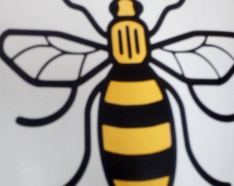Manchester bee vinyl sticker with yellow stripes for walls, furniture, cars, windows etc in support of the we love Manchester fund
