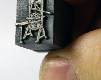 Vintage letterpress printing block, old printing press