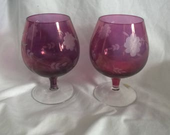 A Pair of Bergandy Coloured Etched Brandy Glasses