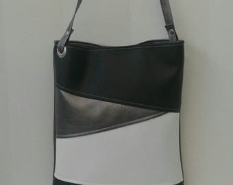 black vinyl crossbody bag