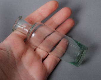 Antique small blue glass bottle, medical or laboratory bottle.