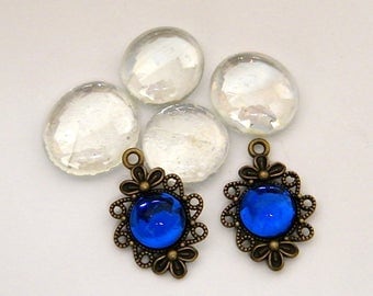 2 charms, pendants bronze, ultramarine blue glass cabochons