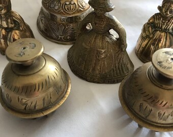 Vintage Brass Bells - A lady belt group of Vintage Ladies and other bells made in brass.