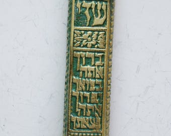 A vintage solid brass mezuzah made in Israel.
