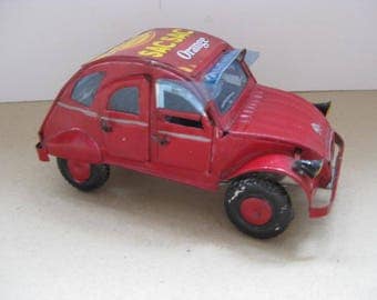 Hand made red tin French "Deux Chevaux" car.