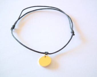Black thin bracelet and a hammered antique gold