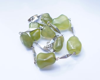 Silver necklace with peridot stones