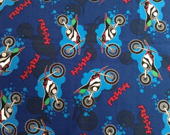 Motorcycle/Freestyle on blue background cotton fabric by the yard