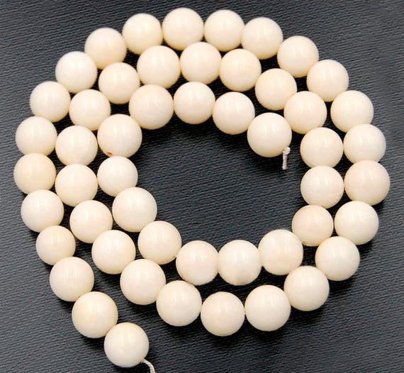 white coral beads        
        <figure class=