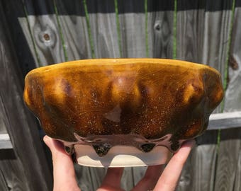 Ceramic bumpy bowl with glaze drips, speckled temmoku glaze