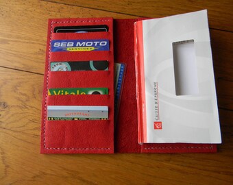 Checkbook and red leather card holder