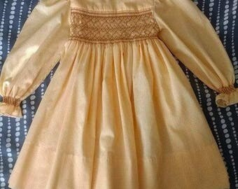 Yellow dress blue smocked peter pan collar. Yellow dress blue smocked peter pan collar.