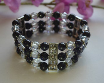 Bracelet, 7 inch handmade dark blue goldstone three strand stretch bracelet