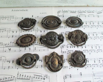 Nine Ornate Mismatched Vintage Drawer Pulls