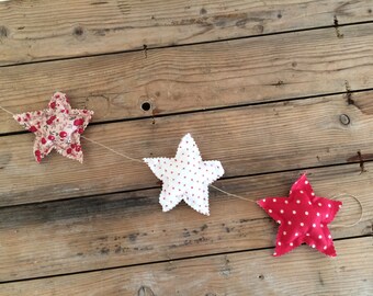 3 stars in red tissue Garland