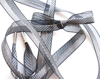 black shoelaces with silver tips