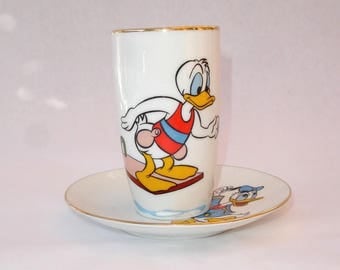 Spanish Santa Clara vintage porcelain tumbler and saucer signed Moises Alverez, Santa Clara Walt Disney Productions Donald Duck, 1960s