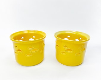 Two yellow flower pots