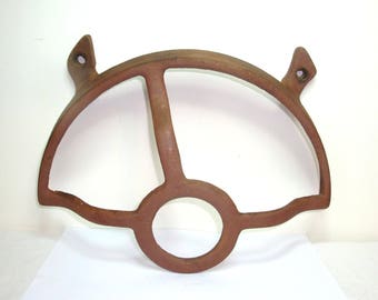 Antique rust. Treadle sewing machine cast iron part. Wheel guard. Replacement part or wall decor. Can mount using 2 bolts. 12" wide, 8" tall
