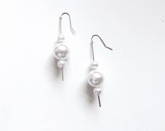 Long triple pearl earrings