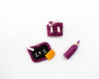 charm Binder + charcoal + purple fimo pencil