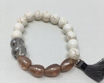 White, Taupe, and Clear, beaded bracelet with tassel