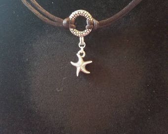 Silky cord with a starfish charm on a antique silver bubbled toggle