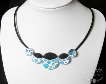 Polymer clay necklace in relief, round blue bubbles