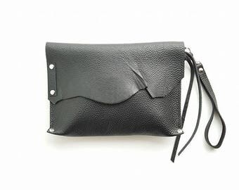 black leather wristlet clutch bag