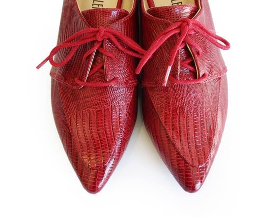 red leather shoes made of skin