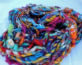 Hand spun thick and thin art yarn coils 'Mardi Gras'