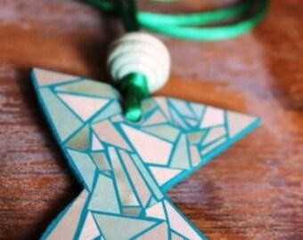 wooden necklace decorated with paper