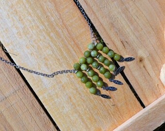 Chain & beaded necklace with silver colored accents to show your alternative team spirit