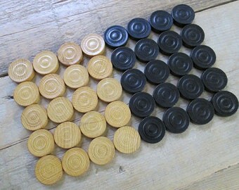 Lot of 40 vintage wooden checkers, game pieces.