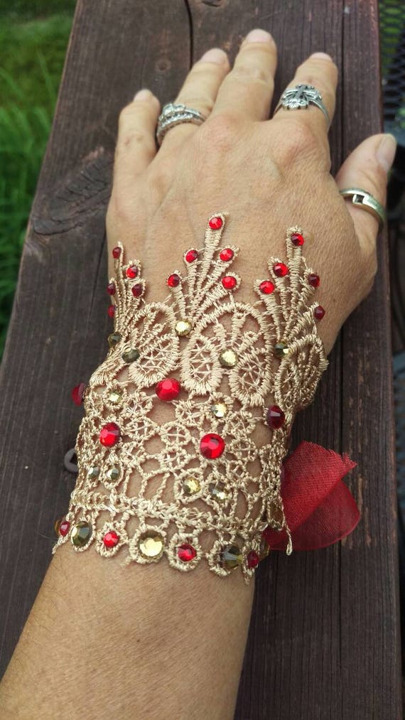 lace cuff bracelet with red and gold rhinestones with