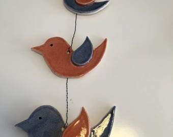 set of three hanging birds