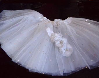 Tutu has silver glitter and matching headband