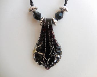language in black and silver murano glass