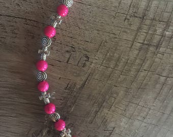 Fuschia pink cross bracelet