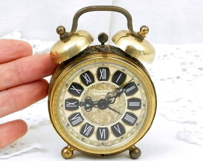 Small Working Vintage West German 1960s Metal Mechanical Wind Up Alarm Clock with Roman Numerals and Filigree Decoration, Mid Century Small Working Vintage West German 1960s Metal Mechanical Wind Up Alarm Clock with Roman Numerals and Filigree Decoration, Mid Century