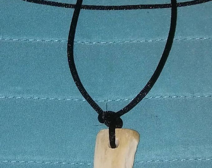 Hand carved Wolf tooth pendants