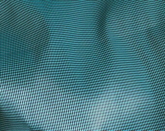 Fabric has small tiles in 145 wide turquoise Green