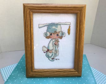 Vintage 8"x10" Framed "Precious Moments" Cross Stitch- "Graduate Girl"... Excellent Condition!!