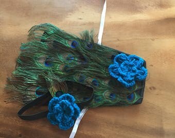 Peacock baby outfit 2pc ties around waist and has a headband